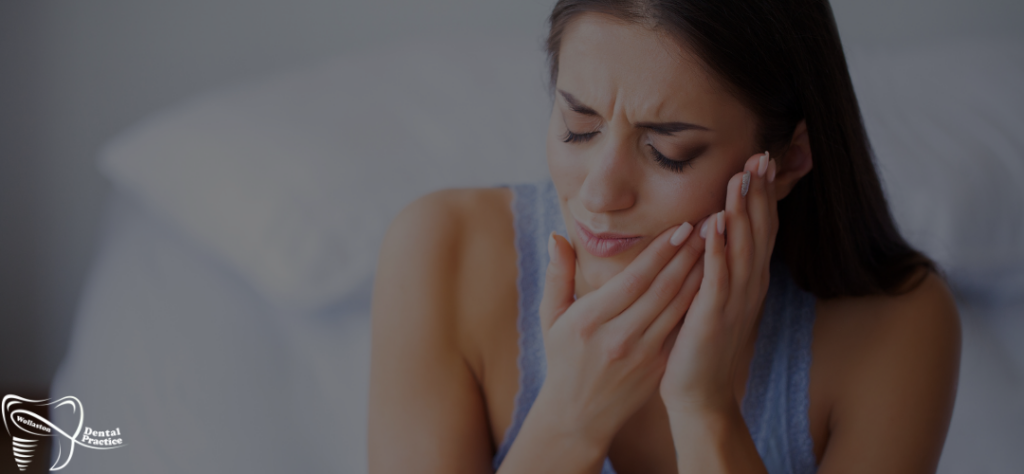 extreme tooth pain cannot sleep - photo with a woman in dental pain